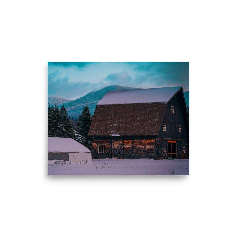 Rustic barn in snowy Adirondack Mountain landscape at dusk