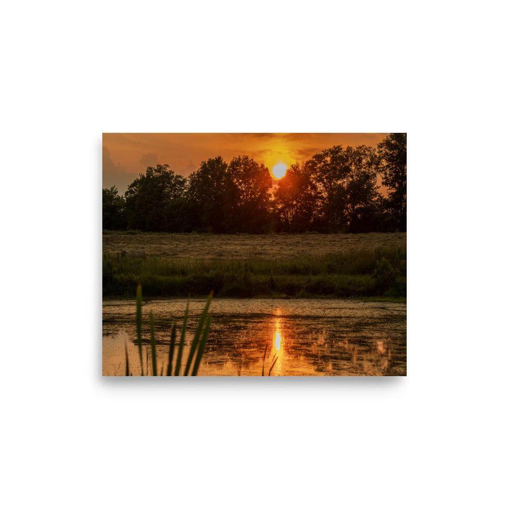 Summer solstice sunset over a tranquil lake with trees in the background, showcased as a motivational matte-finish poster.